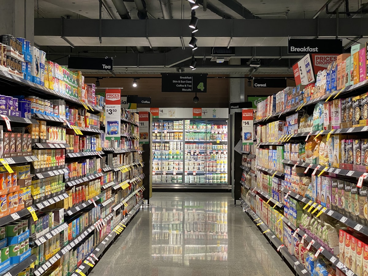 Supermarket aisle stocked with fast-moving consumer goods